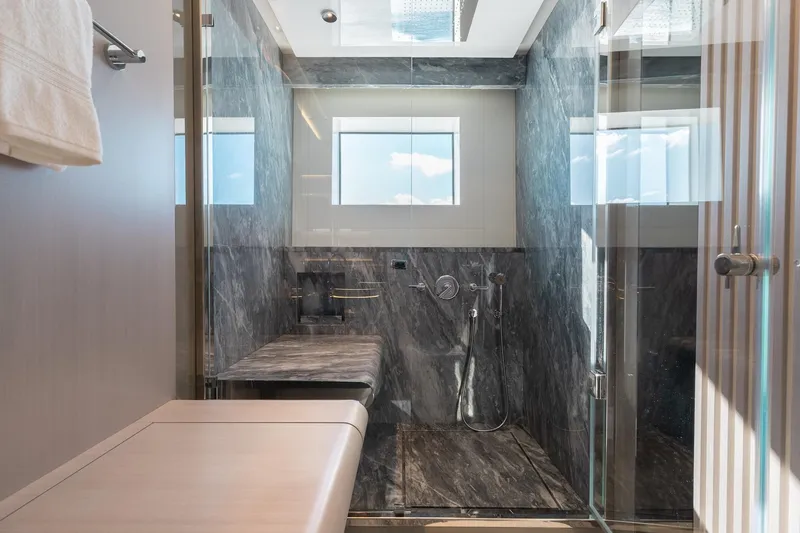 Slide: The Image of Luxurious bathroom in 2024 Mangusta Oceano 44 yacht with marble shower and modern fixtures. - 38