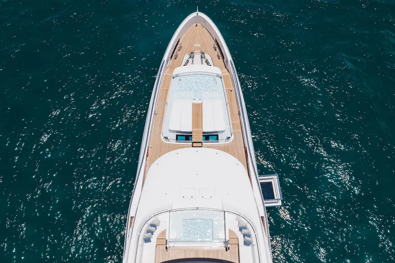 Slide: The Image of Aerial view of 2024 Mangusta Oceano 44 yacht on sparkling blue water. - 5
