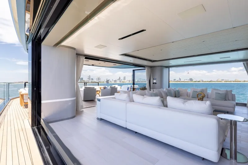 Slide: The Image of Luxurious 2024 Mangusta Oceano 44 yacht interior with ocean view and modern white seating. - 50