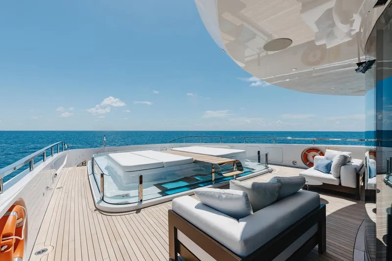 Slide: The Image of Luxurious deck of 2024 Mangusta Oceano 44 yacht with ocean view and plush seating. - 54
