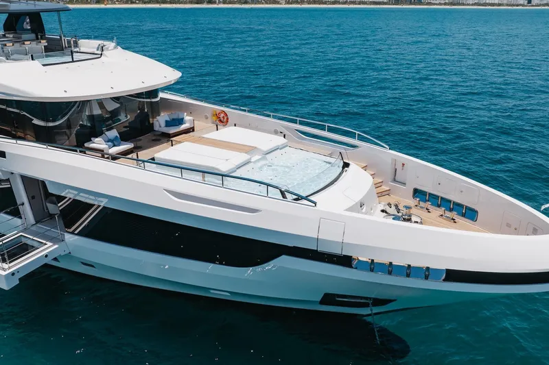 Slide: The Image of Luxurious 2024 Mangusta Oceano 44 yacht with spacious deck and pool on open sea. - 6