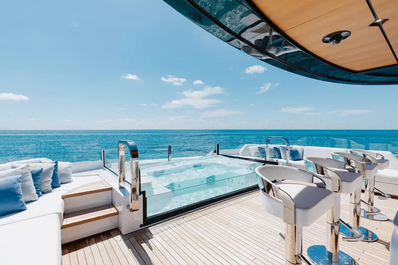 Slide: The Image of Luxurious 2024 Mangusta Oceano 44 yacht deck with jacuzzi and ocean view. - 65