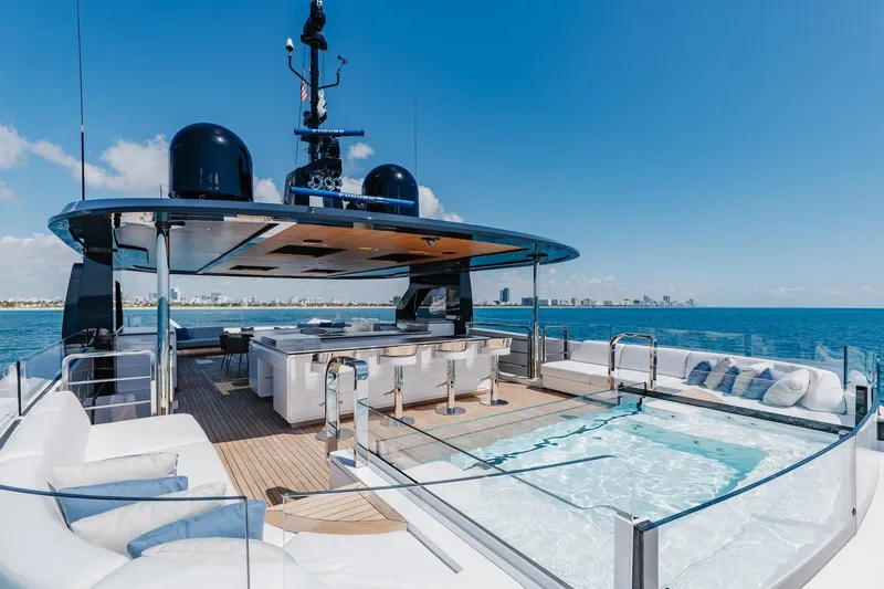 Slide: The Image of Luxurious 2024 Mangusta Oceano 44 yacht with pool and seating, cruising on a sunny day. - 67