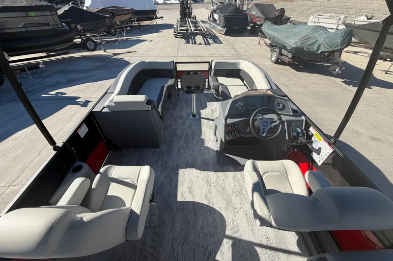 Slide: The Image of 2026 Sylvan R-22 LZ DH pontoon boat interior with seating and steering console. - 5