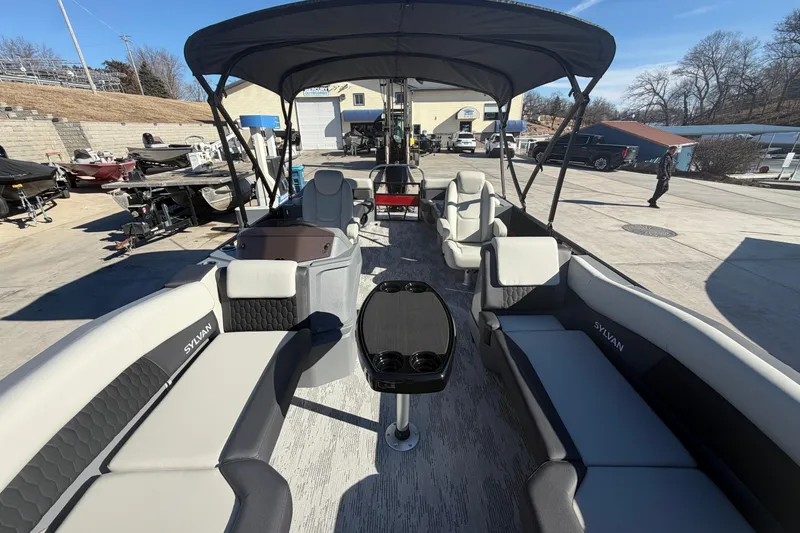 Slide: The Image of 2026 Sylvan R-22 LZ DH pontoon boat with spacious seating and canopy in a marina setting. - 6