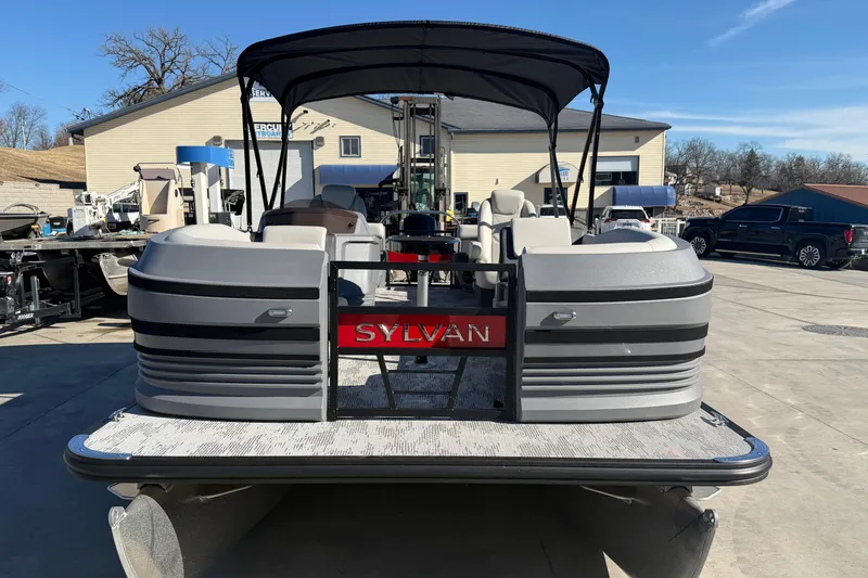 Slide: The Image of 2026 Sylvan R-22 LZ DH pontoon boat with canopy in a marina setting. - 8