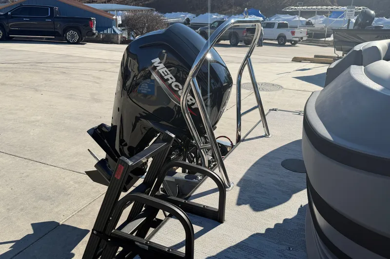 Slide: The Image of 2026 Sylvan R-22 LZ DH boat with Mercury outboard motor in a marina setting. - 9