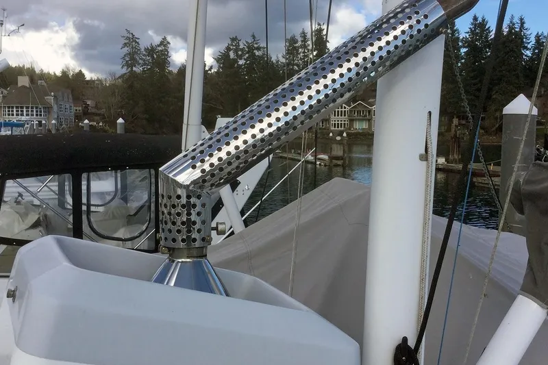 Slide: The Image of Nordhavn 46 yacht detail, 2001 model, featuring a stainless steel exhaust system. - 12