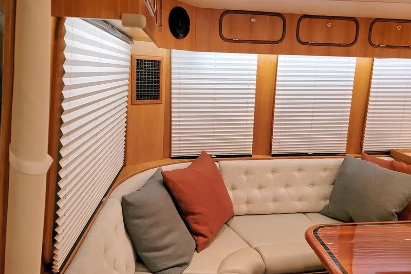 Slide: The Image of Luxurious interior of 2001 Nordhavn 46 yacht with plush seating and elegant wood finishes. - 14