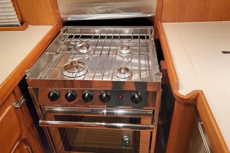Slide: The Image of Stainless steel stove in 2001 Nordhavn 46 yacht kitchen, featuring four burners. - 19