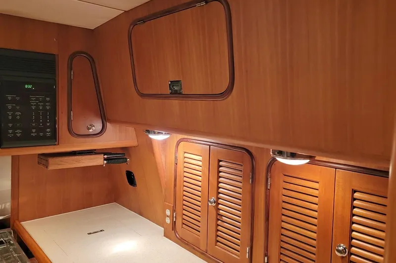 Slide: The Image of Wooden interior of 2001 Nordhavn 46 yacht with cabinets and lighting. - 20