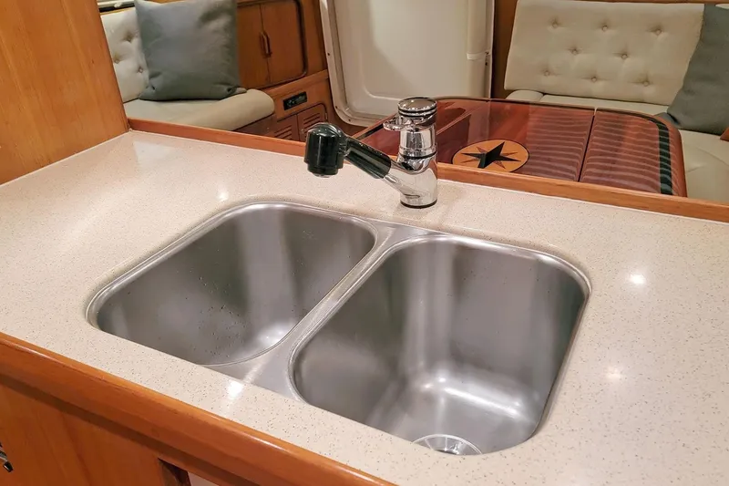 Slide: The Image of Nordhavn 46 (2001) yacht interior with double sink and elegant seating area. - 21