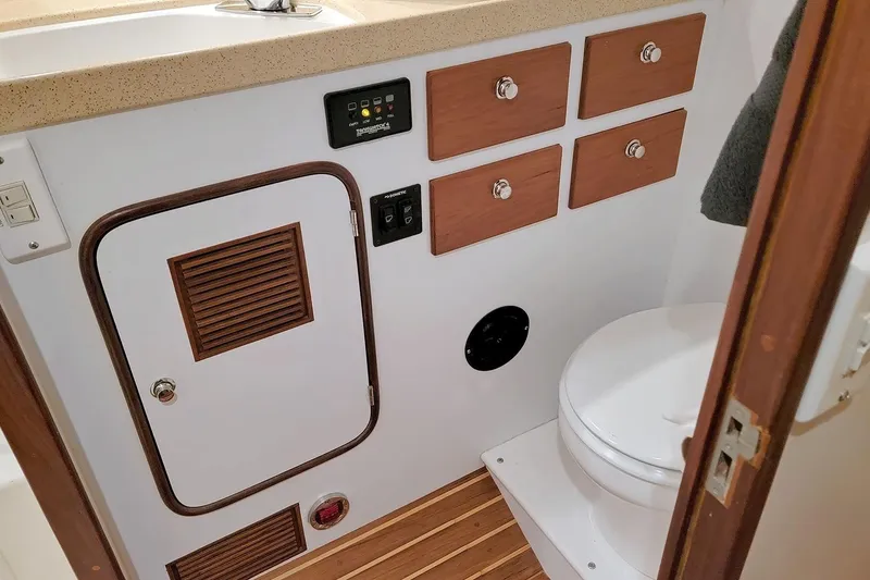 Slide: The Image of Bathroom interior of 2001 Nordhavn 46 yacht with wooden accents and modern fixtures. - 23