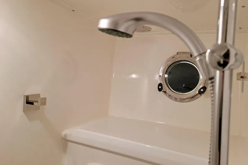 Slide: The Image of Interior of 2001 Nordhavn 46 yacht bathroom with shower and porthole. - 26