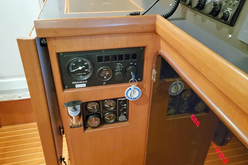 Slide: The Image of Control panel of a 2001 Nordhavn 46 yacht, featuring Yanmar engine gauges. - 34