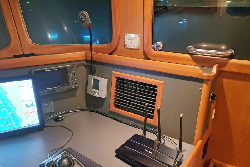 Slide: The Image of Pilothouse of 2001 Nordhavn 46 yacht with navigation equipment and router. - 37
