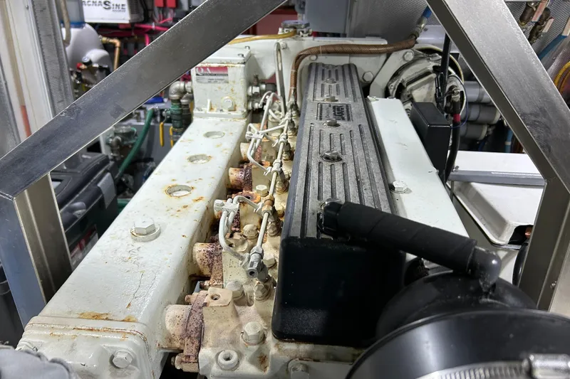 Slide: The Image of Engine compartment of a 2001 Nordhavn 46 yacht, showcasing detailed machinery components. - 53