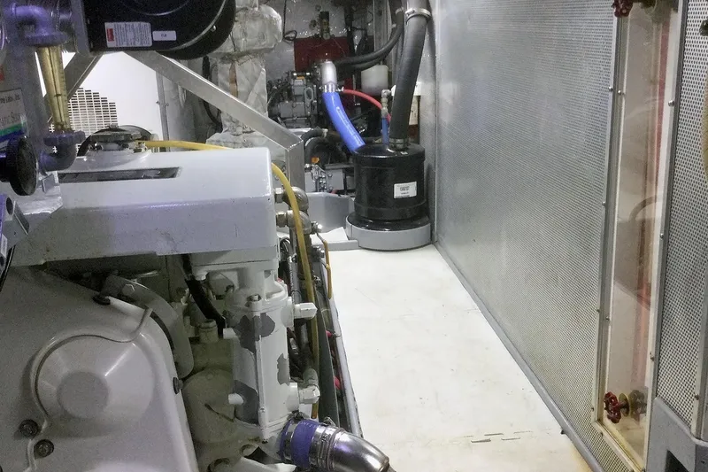Slide: The Image of Engine room of a 2001 Nordhavn 46 yacht, showcasing machinery and equipment. - 56