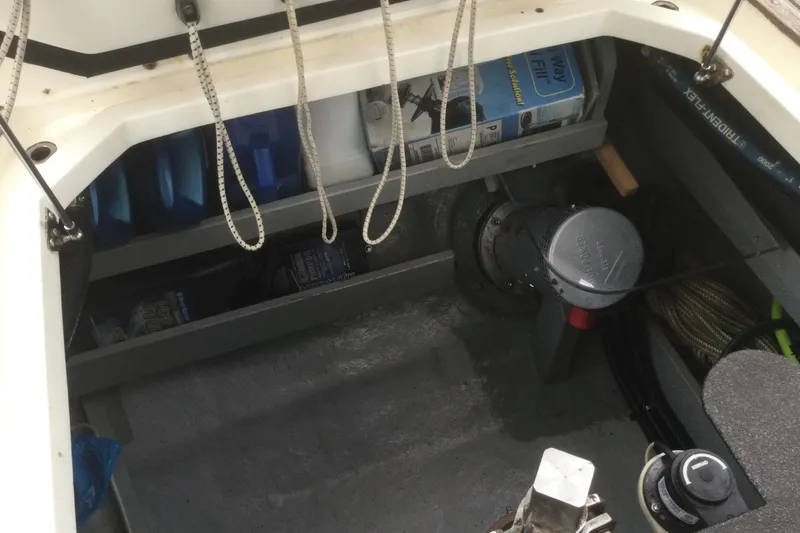 Slide: The Image of Storage compartment of a 2001 Nordhavn 46 boat with ropes and equipment. - 65