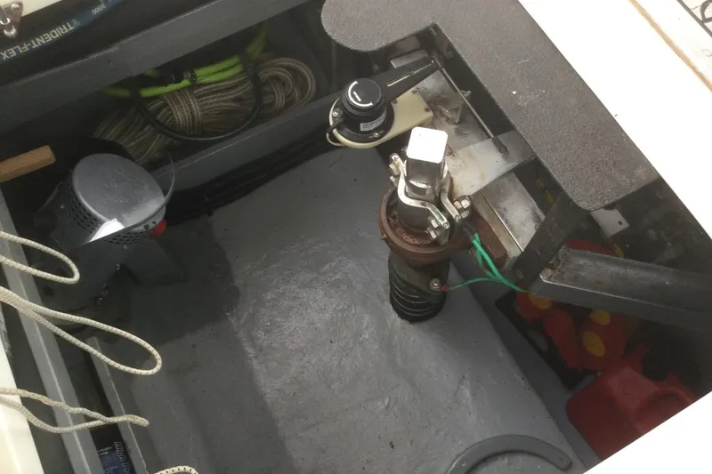 Slide: The Image of Engine compartment of a 2001 Nordhavn 46 boat, showing mechanical components and wiring. - 66