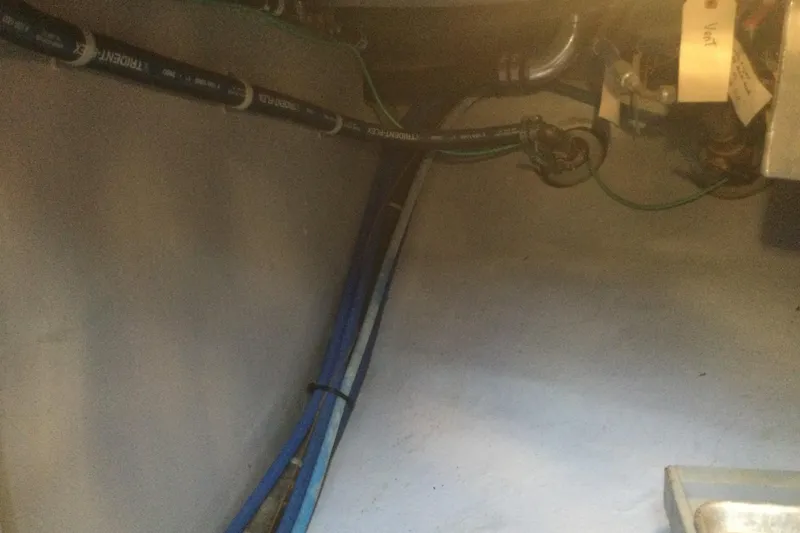 Slide: The Image of Engine room of 2001 Nordhavn 46 yacht showing pipes and wiring. - 68