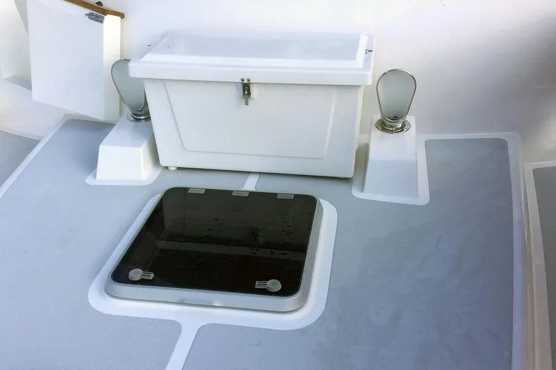 Slide: The Image of 2001 Nordhavn 46 yacht deck with storage compartment and hatch. - 8