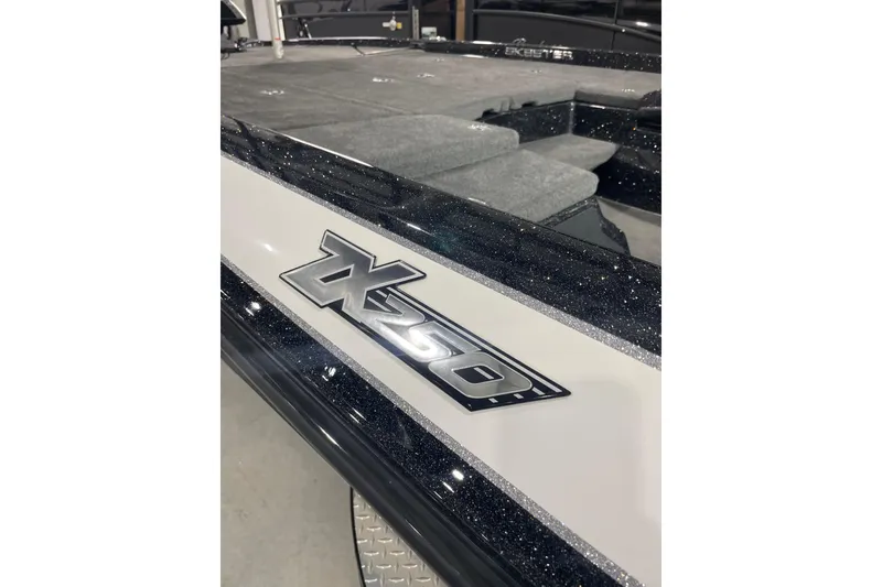 Slide: The Image of 2018 Skeeter ZX250 bass boat in showroom, featuring spacious deck and modern design. - 8