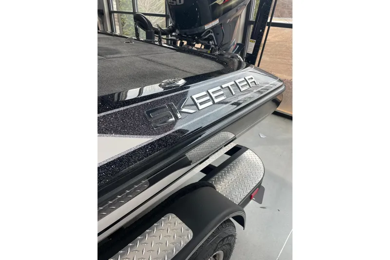 Slide: The Image of 2018 Skeeter ZX250 dashboard with Humminbird Helix 12 fishfinder and steering wheel. - 9