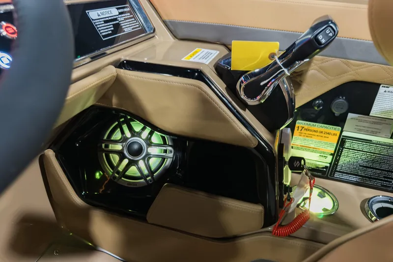 Slide: The Image of 2026 Godfrey SanPan 2500 SBC boat interior with illuminated speaker and control panel. - 26