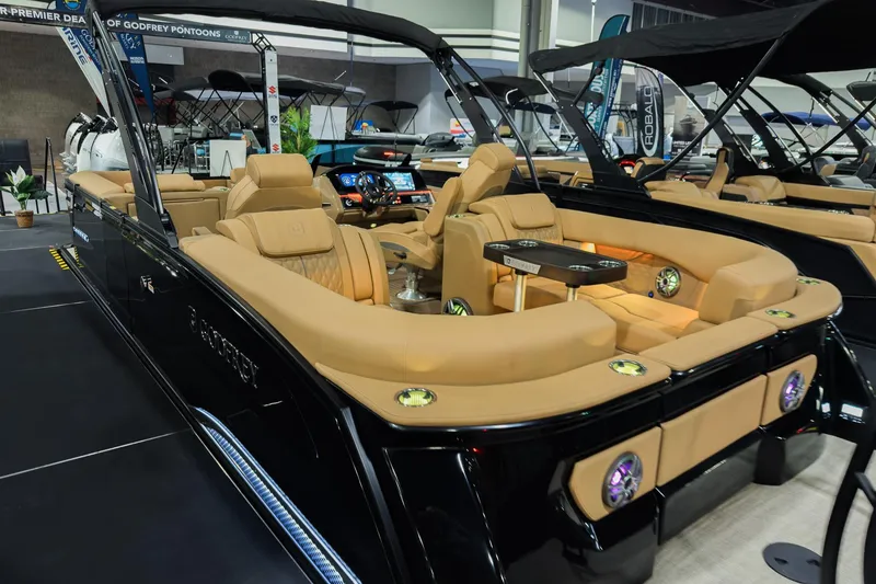 Slide: The Image of 2026 Godfrey SanPan 25' Split Bench Co-Captain pontoon boat with luxurious seating and modern design. - 41