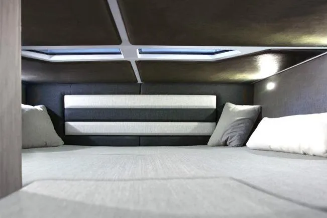 Slide: The Image of Interior cabin of 2026 Ranieri CAYMAN 35.0 EXECUTIVE, featuring modern design and comfortable bedding. - 15