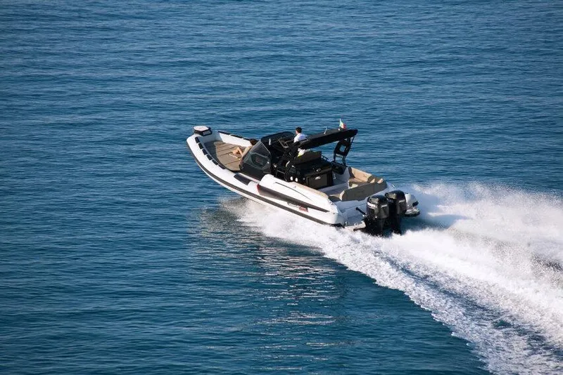 Slide: The Image of 2026 Ranieri CAYMAN 35.0 EXECUTIVE cruising on open water, showcasing sleek design and powerful engines. - 2