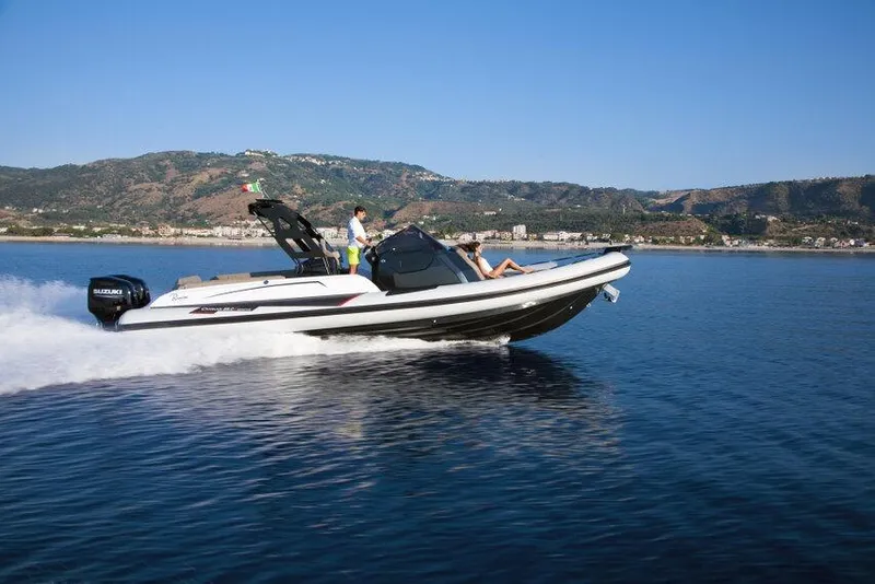 Slide: The Image of 2026 Ranieri CAYMAN 35.0 EXECUTIVE cruising on calm waters with scenic mountain backdrop. - 6