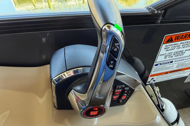 Slide: The Image of Throttle control of 2024 Bennington 25 QX Swingback boat with warning labels visible. - 11