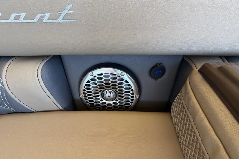 Slide: The Image of 2024 Bennington 25 QX Swingback interior with speaker and USB port detail. - 20