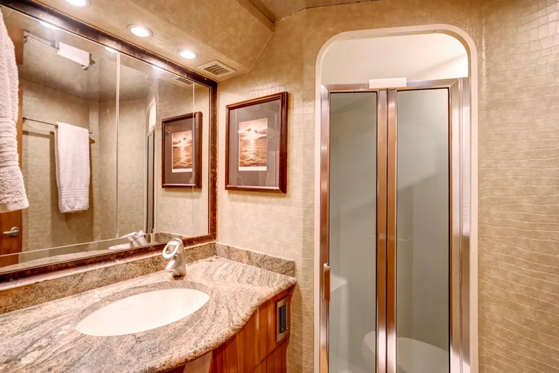 Slide: The Image of Luxurious bathroom in 2007 Viking 68 Convertible yacht with elegant fixtures and modern design. - 12