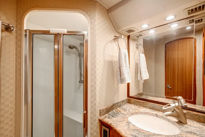 Slide: The Image of Luxurious bathroom in 2007 Viking 68 Convertible yacht with shower and elegant vanity. - 14