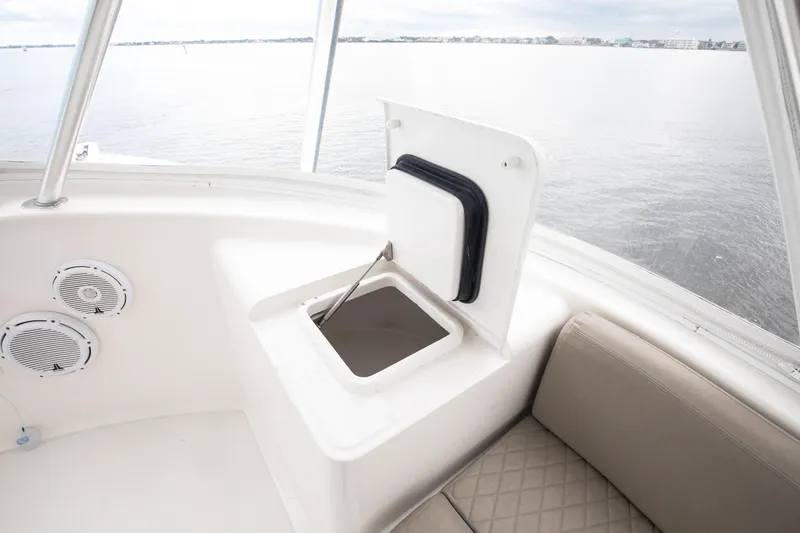 Slide: The Image of Interior view of 2007 Viking 68 Convertible yacht with open storage compartment and speakers. - 21