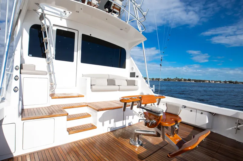 Slide: The Image of Luxurious 2007 Viking 68 Convertible yacht deck with fishing chair, overlooking serene waters. - 25