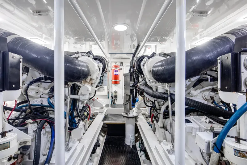 Slide: The Image of Engine room of 2007 Viking 68 Convertible yacht, showcasing dual engines and equipment. - 31