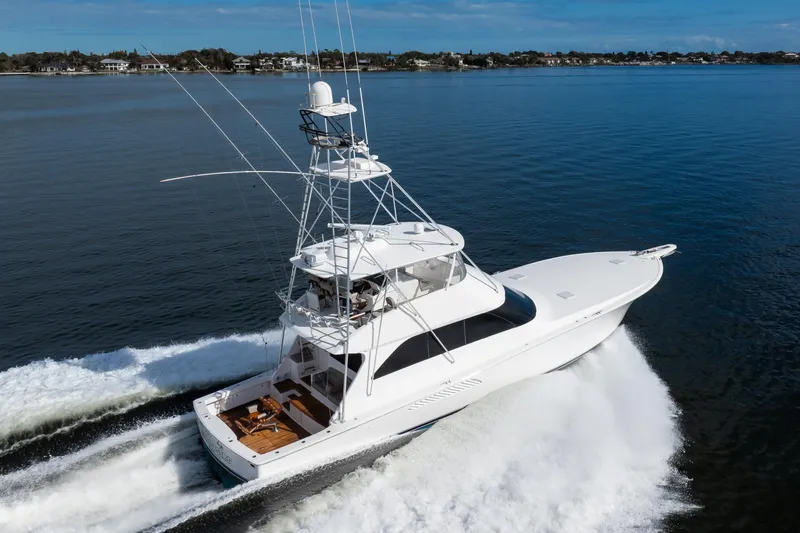 Slide: The Image of 2007 Viking 68 Convertible yacht cruising on open water, showcasing sleek design and performance. - 37