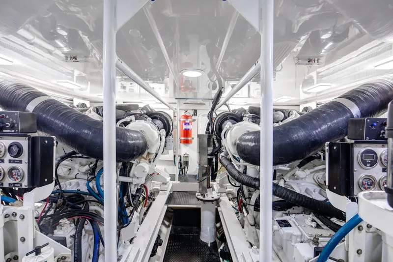 Slide: The Image of Engine room of 2007 Viking 68 Convertible yacht, featuring dual engines and control panels. - 4