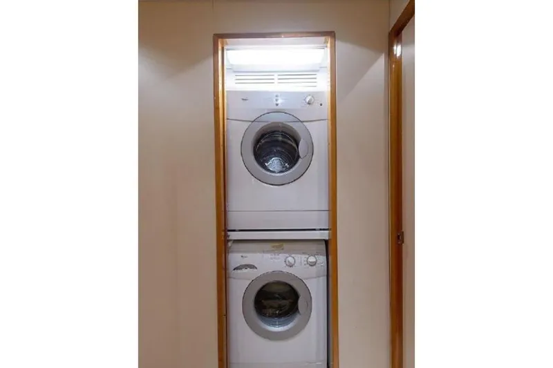 Slide: The Image of Stacked washer and dryer in 2007 Hatteras 68 Convertible yacht interior. - 11
