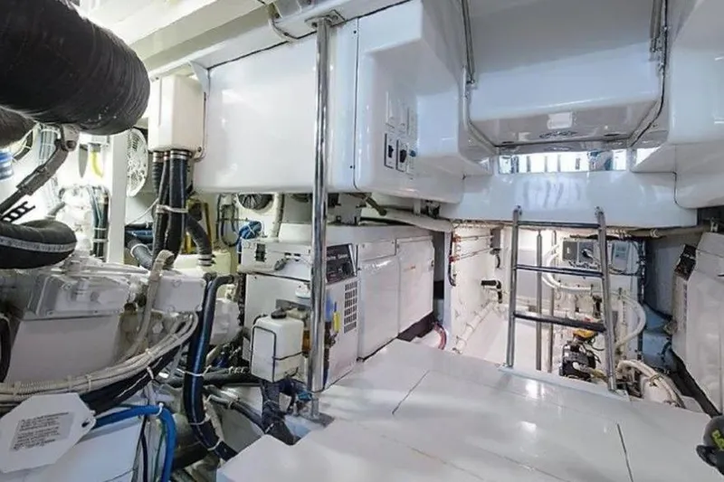 Slide: The Image of Engine room of 2007 Hatteras 68 Convertible yacht, showcasing machinery and equipment. - 12