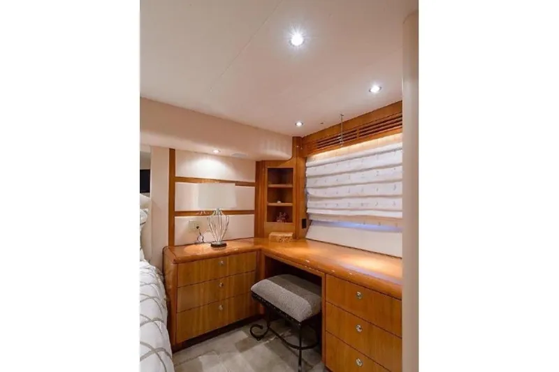 Slide: The Image of Luxurious wooden interior of 2007 Hatteras 68 Convertible yacht with desk and drawers. - 4