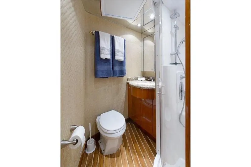 Slide: The Image of Luxurious bathroom in 2007 Hatteras 68 Convertible yacht with modern fixtures and wooden flooring. - 8