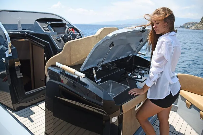 Slide: The Image of Woman on Ranieri CAYMAN 38.0 EXECUTIVE yacht, 2026 model, enjoying onboard amenities. - 11