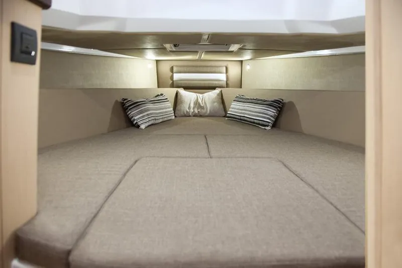 Slide: The Image of Interior cabin of 2026 Ranieri CAYMAN 38.0 EXECUTIVE with cozy bedding and pillows. - 18
