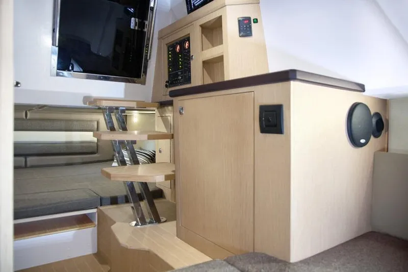 Slide: The Image of Interior of 2026 Ranieri CAYMAN 38.0 EXECUTIVE yacht with modern wooden cabinetry and stairs. - 20