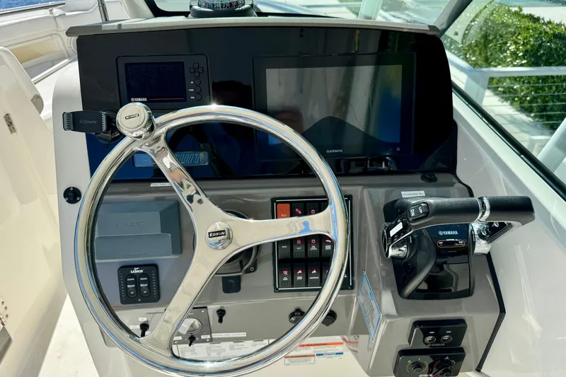 Slide: The Image of 2020 Pursuit DC 266 Dual Console helm with Garmin display and Yamaha controls. - 8